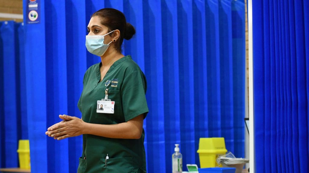 A healthcare worker wearing a mask