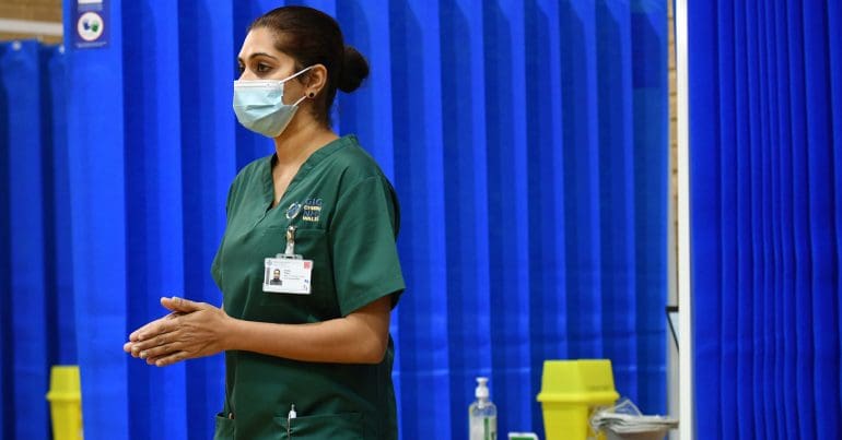 A healthcare worker wearing a mask