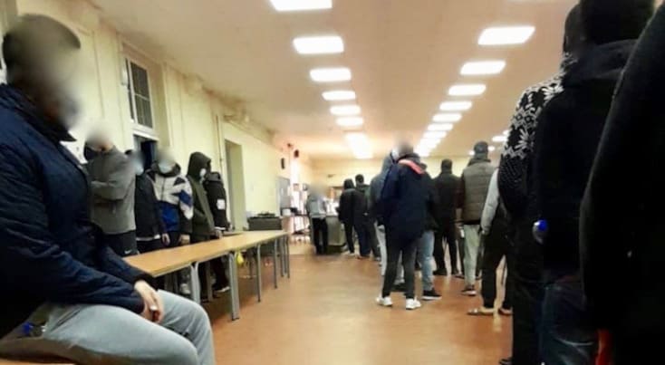 The queue in the dining room at the barracks - photo via Corporate Watch/CROP (with permission)