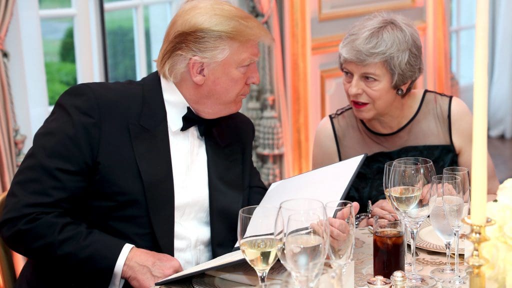 Donald Trump and Theresa May sitting at a black tie event