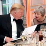 Donald Trump and Theresa May sitting at a black tie event