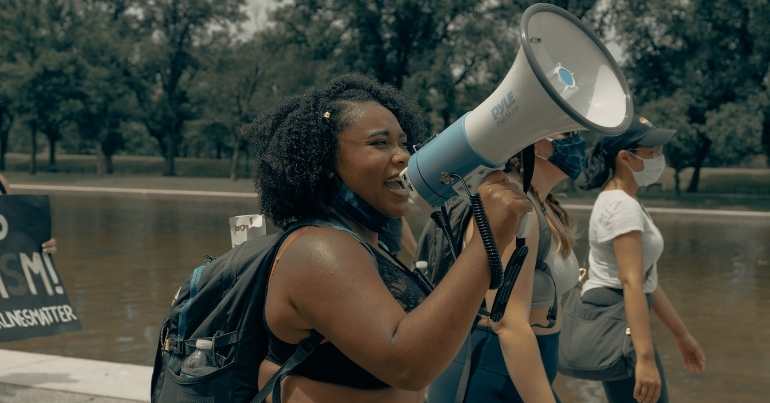 Woman chants with a megaphone at the Black Lives Matter protest in Washington DC