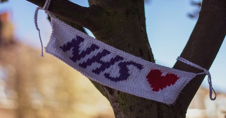 A knitted flag reading "NHS"