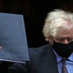 Boris Johnson in a black mask holding up a black folder