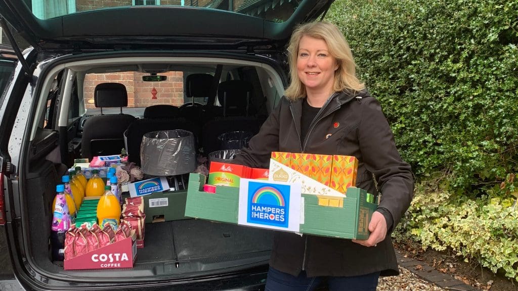 Victoria Hanson holding a box of donations