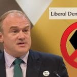 Ed Davey the Lib Dem Logo the BLM fist and a No Entry Sign