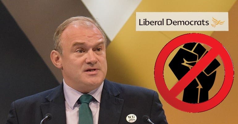 Ed Davey the Lib Dem Logo the BLM fist and a No Entry Sign