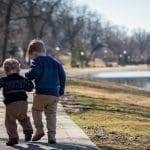 Two children walking to represent child poverty
