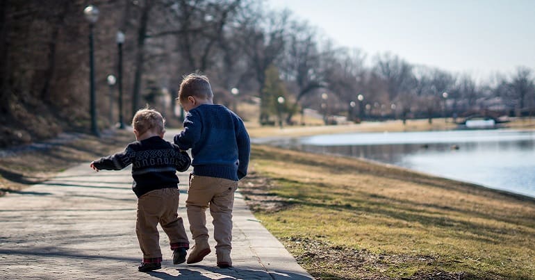 Two children walking to represent child poverty