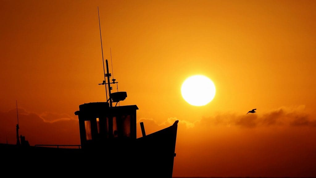 The sun going down on a British fishing boat