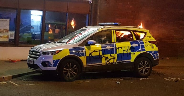 A burning police car at Bristol's Kill the Bill demonstration