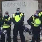 Police protecting the Churchill statue as an example of fascism