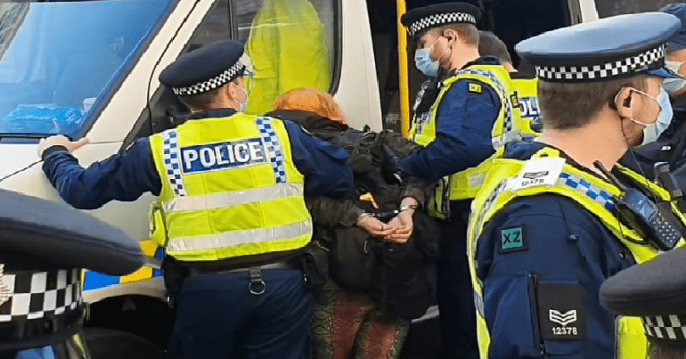 Police pin Samantha Gibson against a van