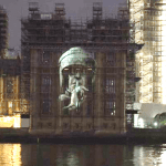 Riot cop image projected on to parliament