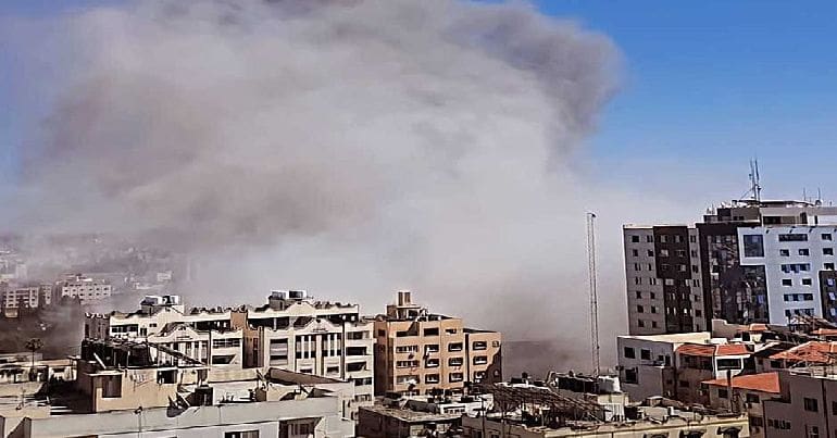 Israeli warplanes bomb a civilian residential building in Gaza