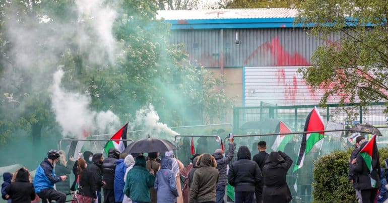 Leicester, United Kingdom, May 24, 2021: After two “Palestine Action” activists were removed and arrested from the rooftop local communities’ have organised a barricade (in picture) and appear to be determined to not let the police leave the area with activists. “Shut Elbit Down”, “Free! Free! Palestine” are among the slogans local residents are shouting. (Photo by Vudi Xhymshiti)