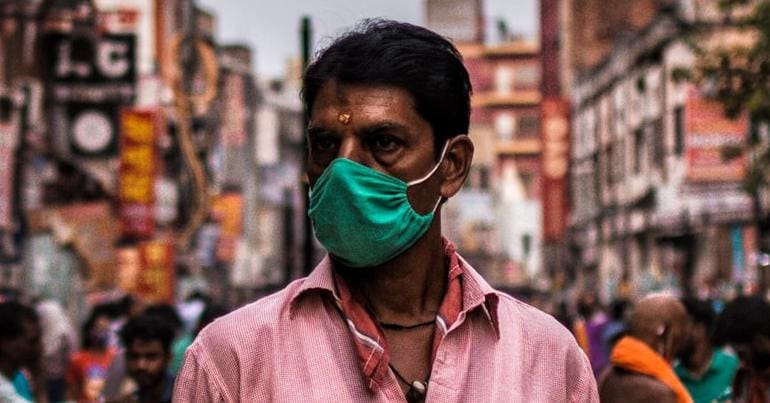 A man sells masks in India