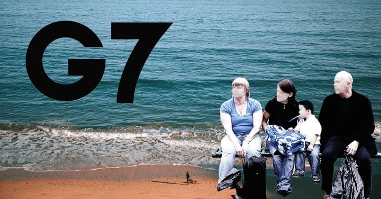 Carbis Bay in Cornwall a homeless family and the G7 logo