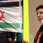A united Israel/Palestine flag and former PLO executive committee member Hanan Ashrawi