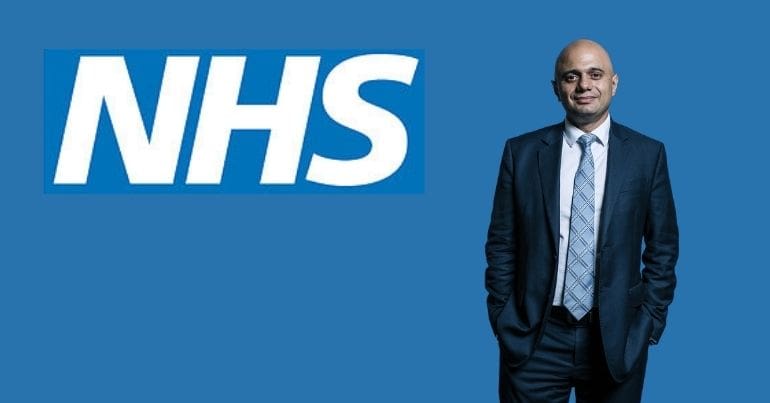 sajid javid in front of the NHS logo