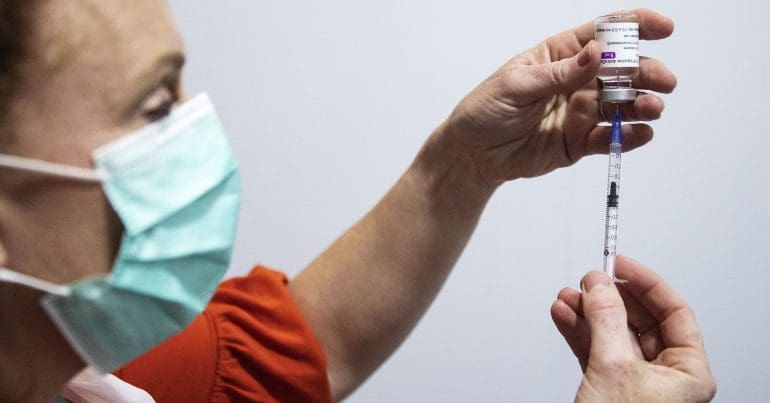 A syringe and a vaccine