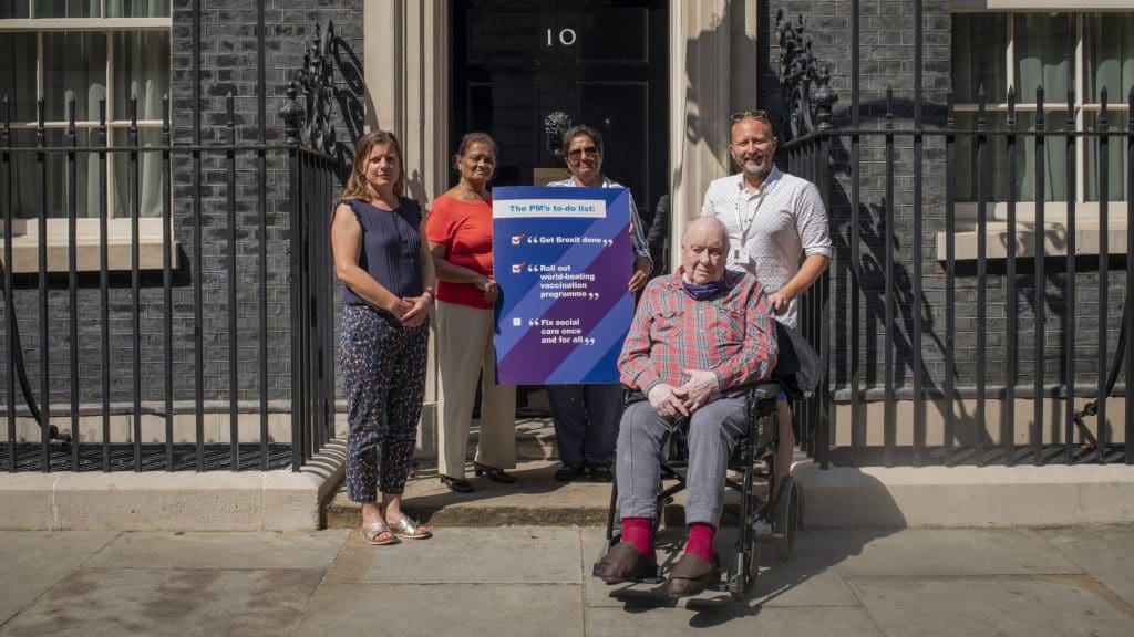 Care activists standing outside 10 Downing Street