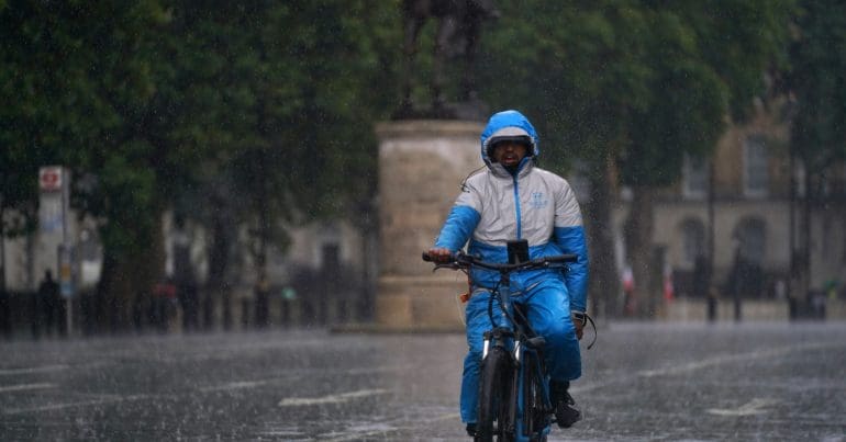 A cyclist on a rainy street in London