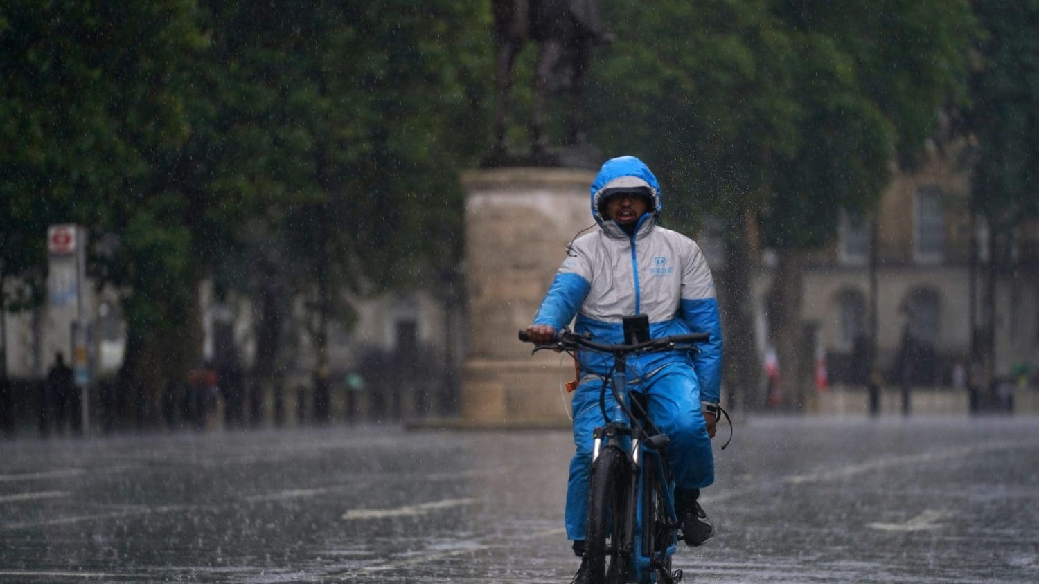 A cyclist on a rainy street in London