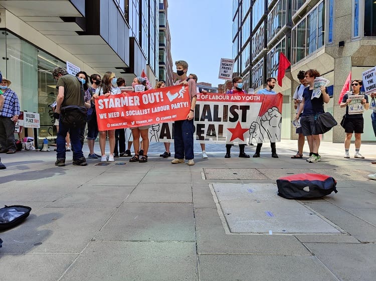 A shot of people protesting at Labour HQ