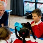 Philip Alston talking to school children