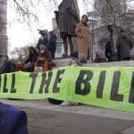 Priti Patel and a #KillTheBill banner