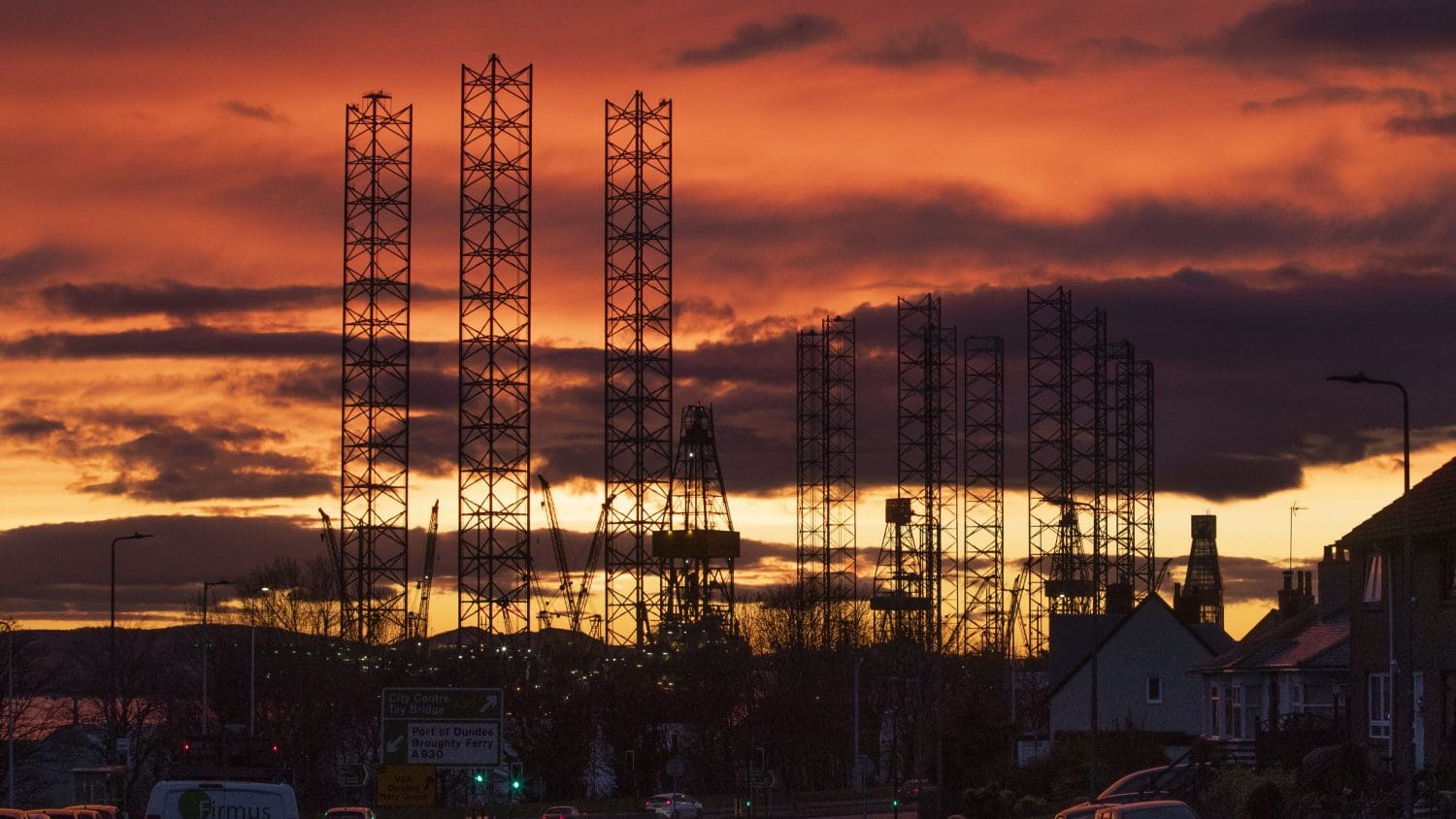 Sunset over a fossil fuel plant