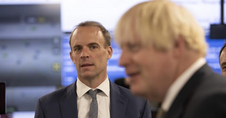 Dominic Raab looking at Boris Johnson