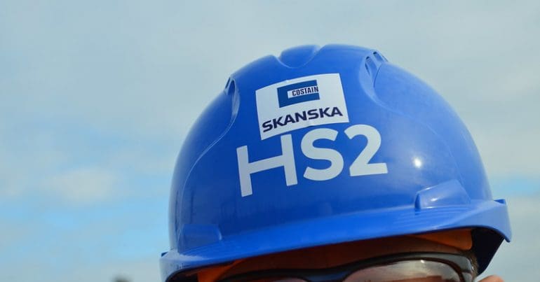 A blue hard hat with the HS2 logo on it