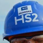 A blue hard hat with the HS2 logo on it
