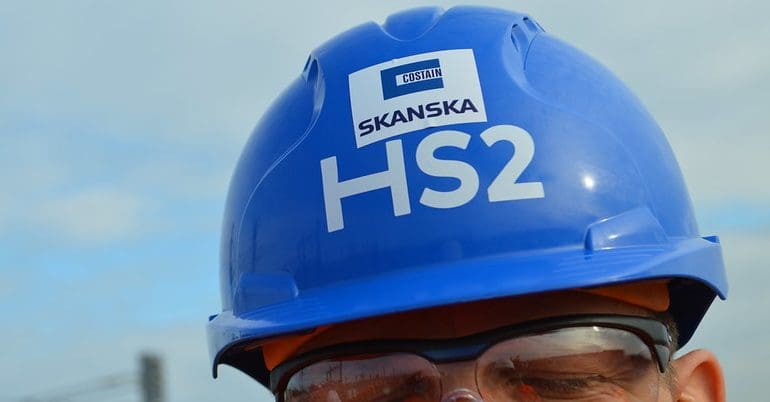 A blue hard hat with the HS2 logo on it