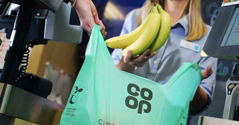 Shopping being pplaced into a shopping bag