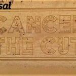 A Universal Credit protest in sand by Unite the Union and the Universal Credit logo