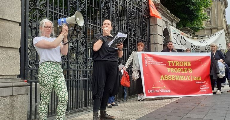 Anti mining protesters addressing protesters at the gates of the Irish parliament