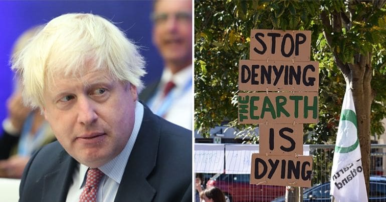 Boris Johnson beside a climate crisis campaign poster