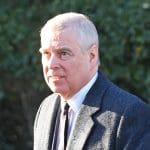 Prince Andrew pictured with half of his face in darkness