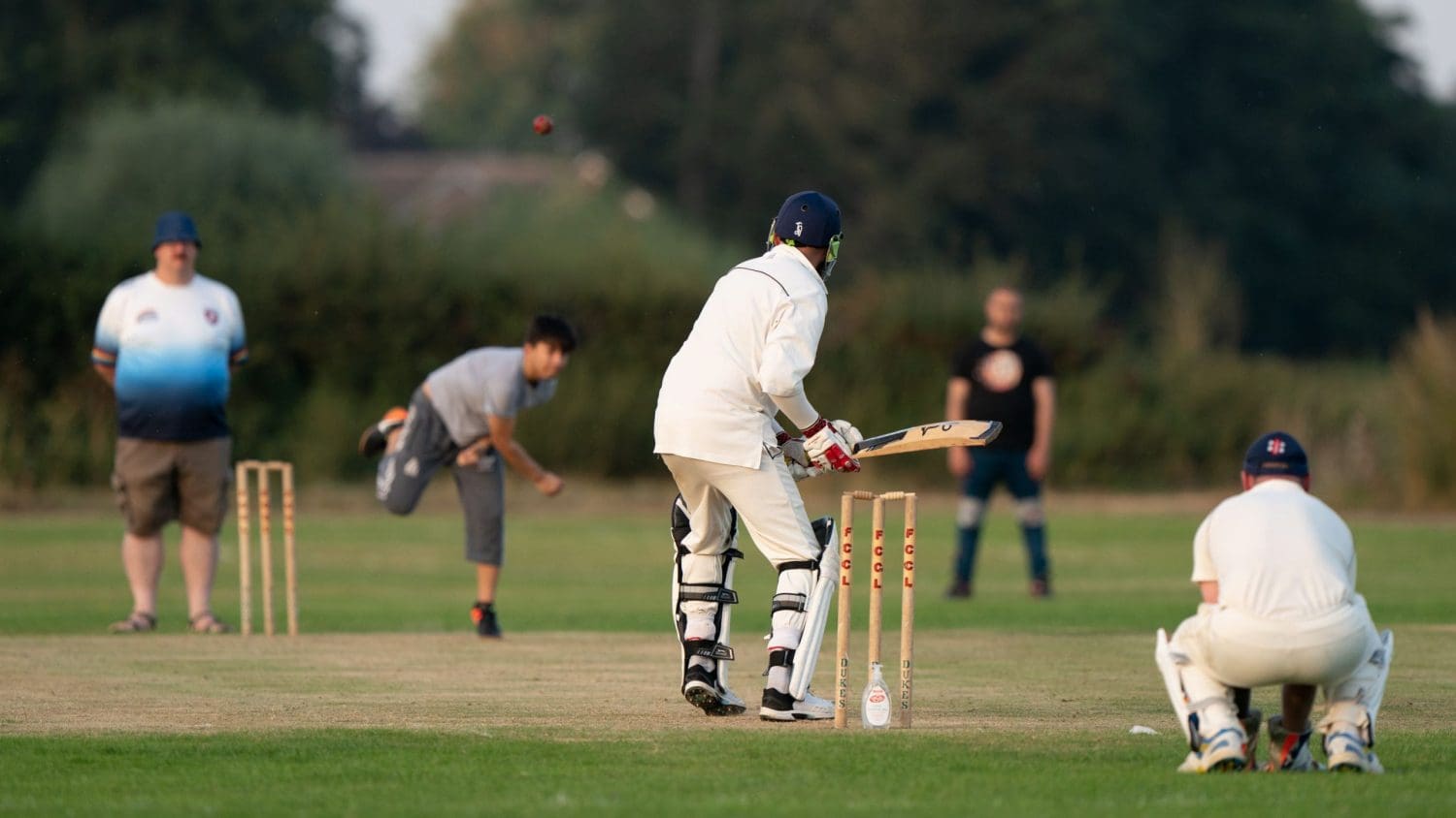 Refugees and local English people playing cricket