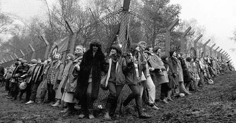Women protesters surround the Greenham Common nuclear RAF base