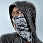 A young black man wearing a hoodie and face covering