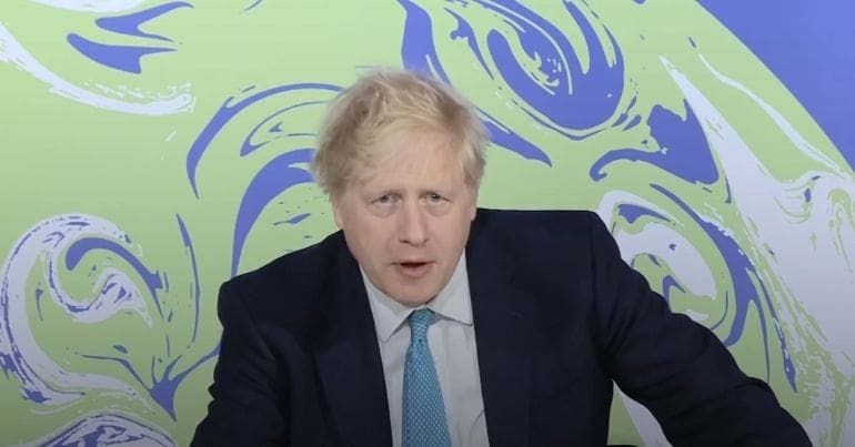 Boris Johnson in front of cop26 logo