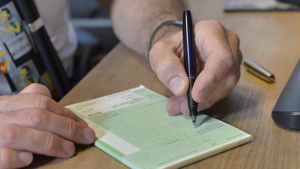 A doctor writing out a prescription