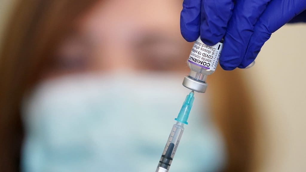 A syringe and vaccine