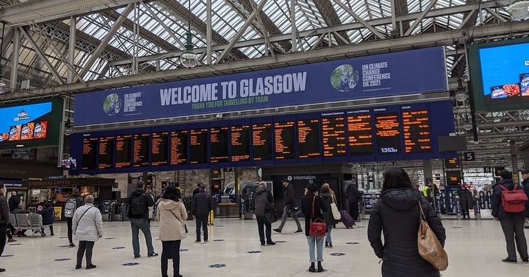 A COP26 'Welcome to Glasgow' sign at Glasgow Central station