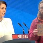 Priti Patel at the Tory conference and a protester holding a sign saying Priti Fascist