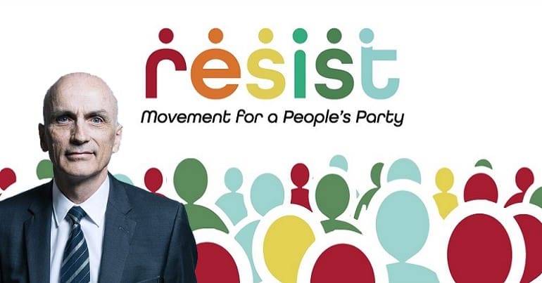 Former MP Chris Williamson in front of a Resist movement banner